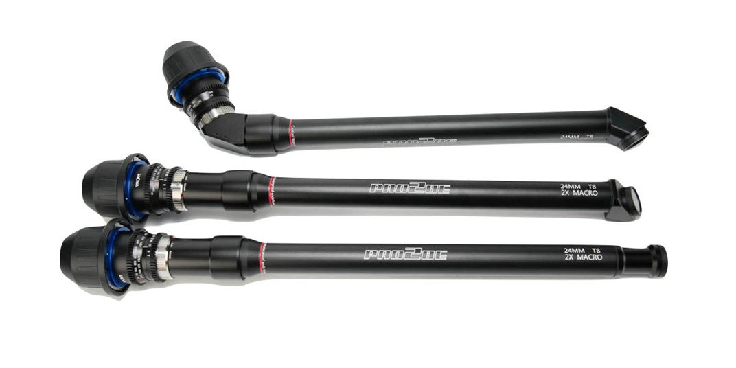 Three black automotive suspension parts with blue and silver fittings.