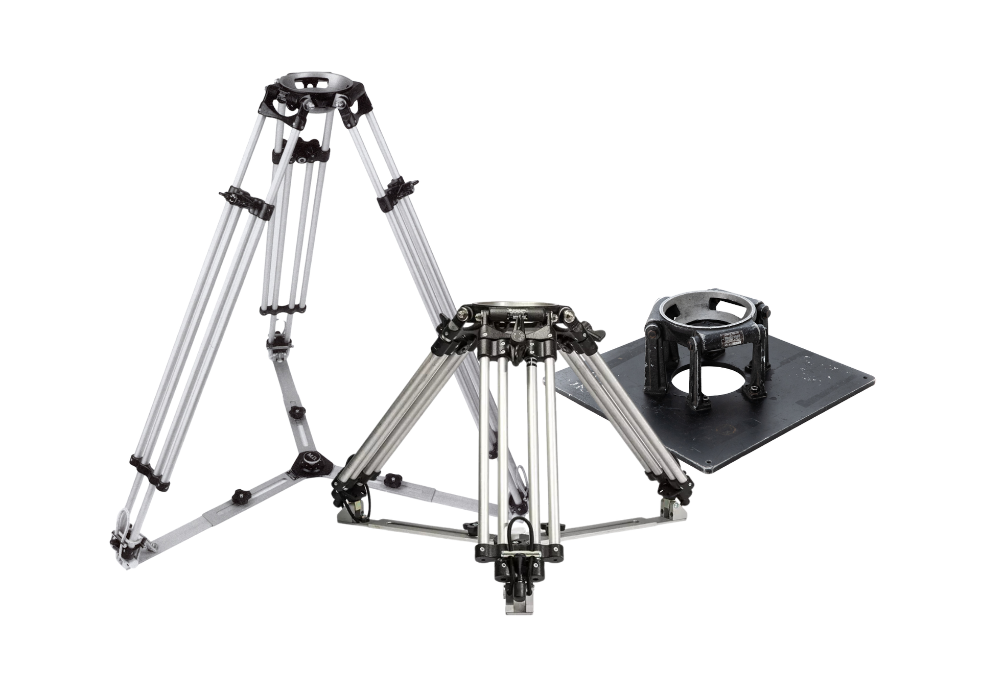 Three professional camera tripods, one collapsed, one upright, and one with a base plate.
