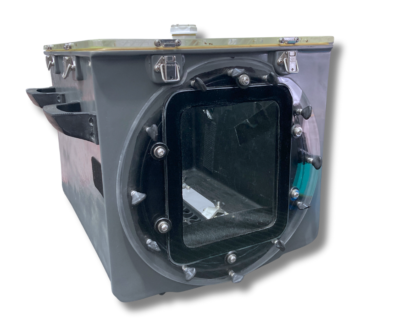 A gray, rectangular metal box with a large, square, clear window and numerous latches and bolts.