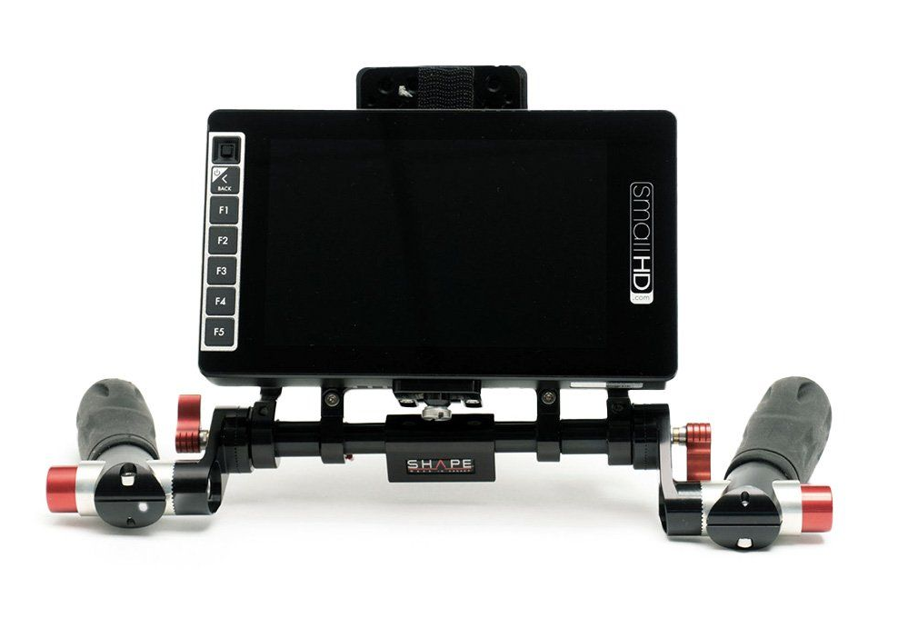 A black SmallHD monitor mounted on a rig with handles for handheld video shooting.