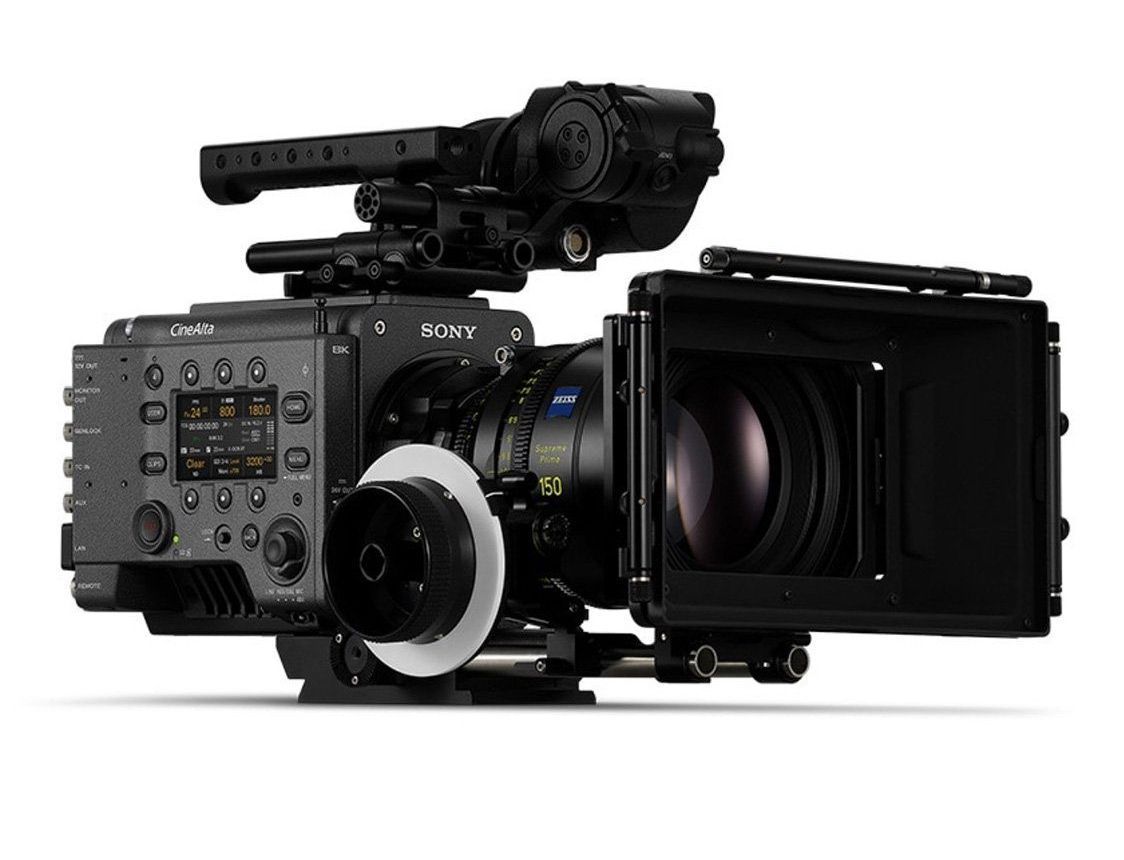 Black cinema camera with accessories, lens attached, and a matte box.