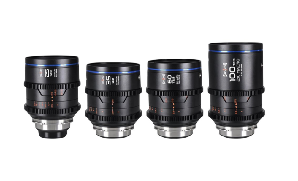 Four black camera lenses with blue rings, various sizes, on a white background.