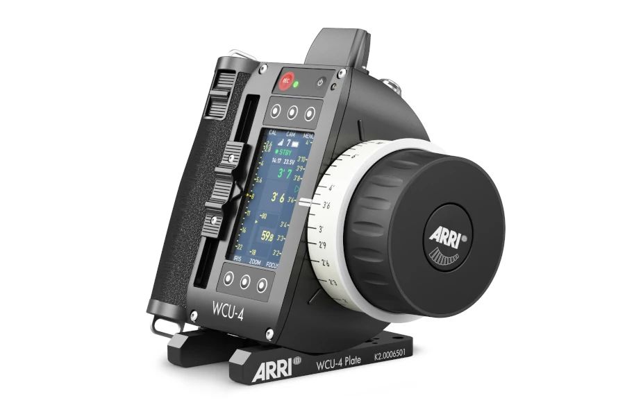 ARRI WCU-4 wireless lens control system, black, with white dial, buttons, and display.