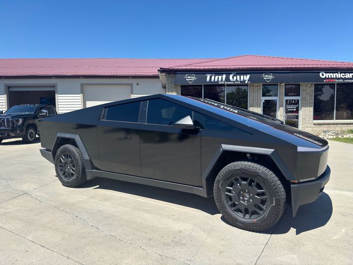 A Man Applying Black Window Tint | Billings, MT | Tint Guy