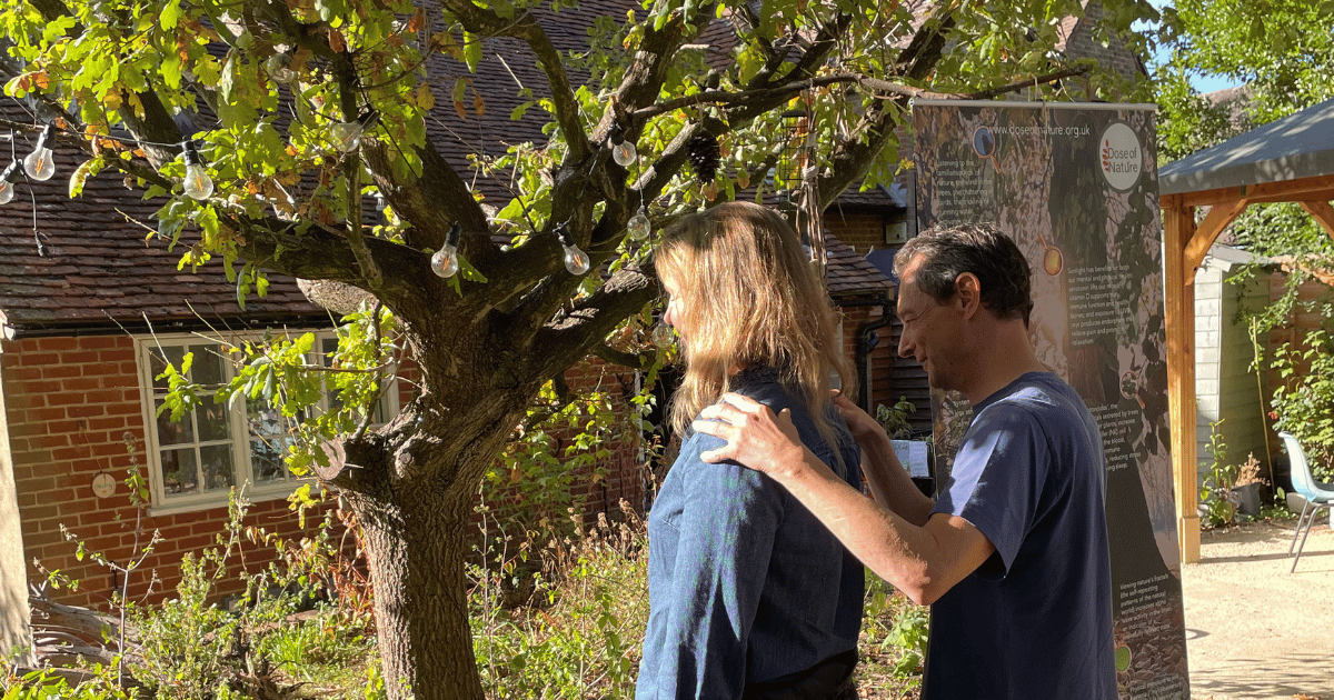 Two new guides taking part in a mindfulness exercise