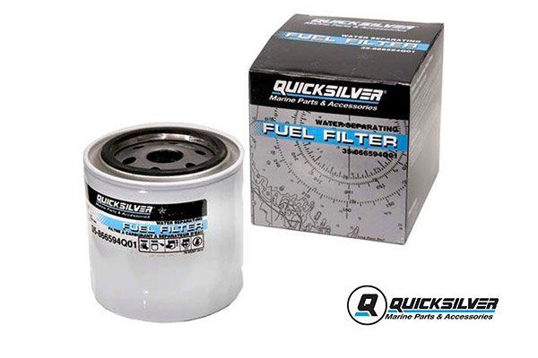a fuel filter is sitting next to a box .