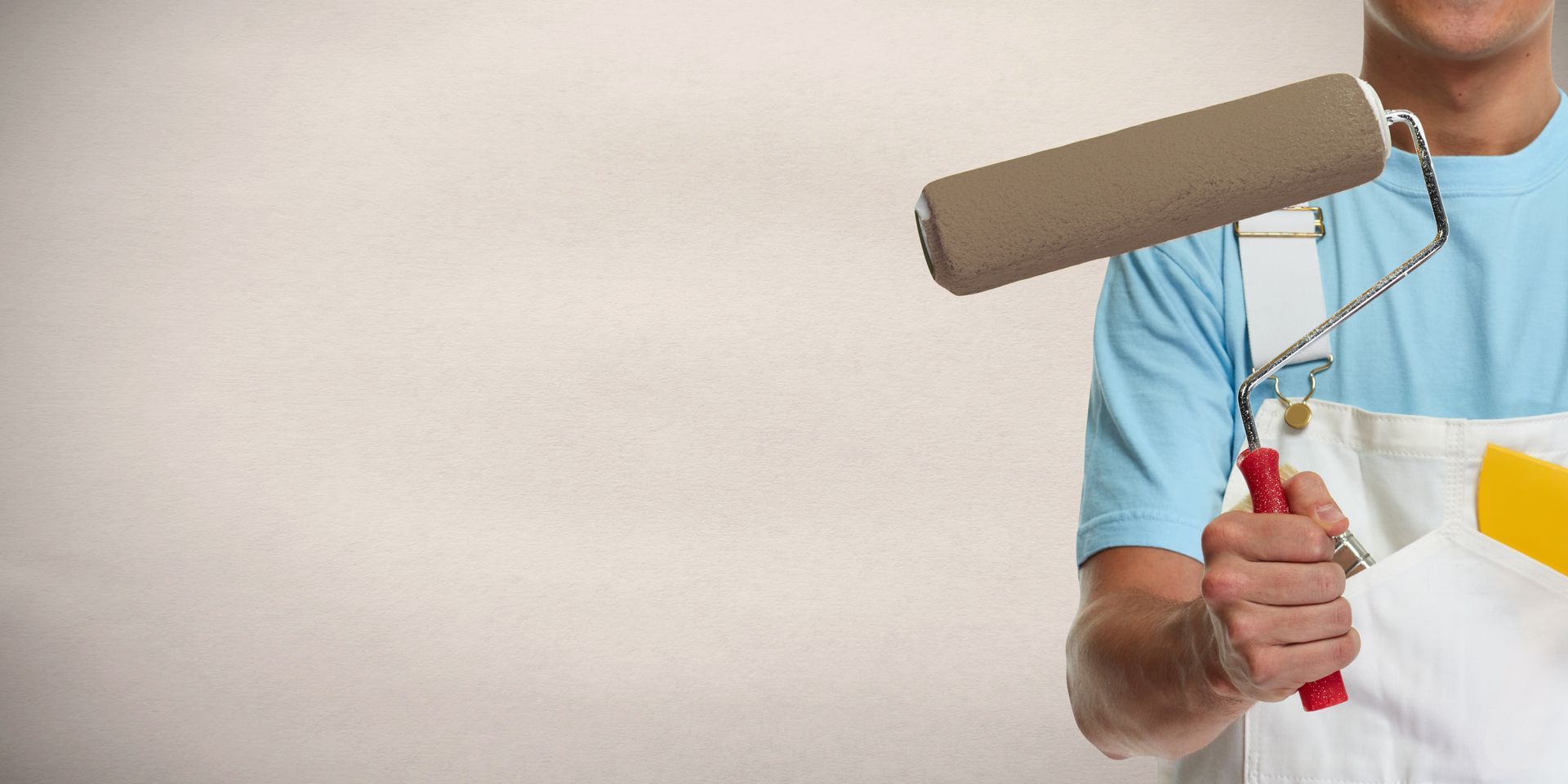Painter hand with painting roller. Painter hand with painting roller.