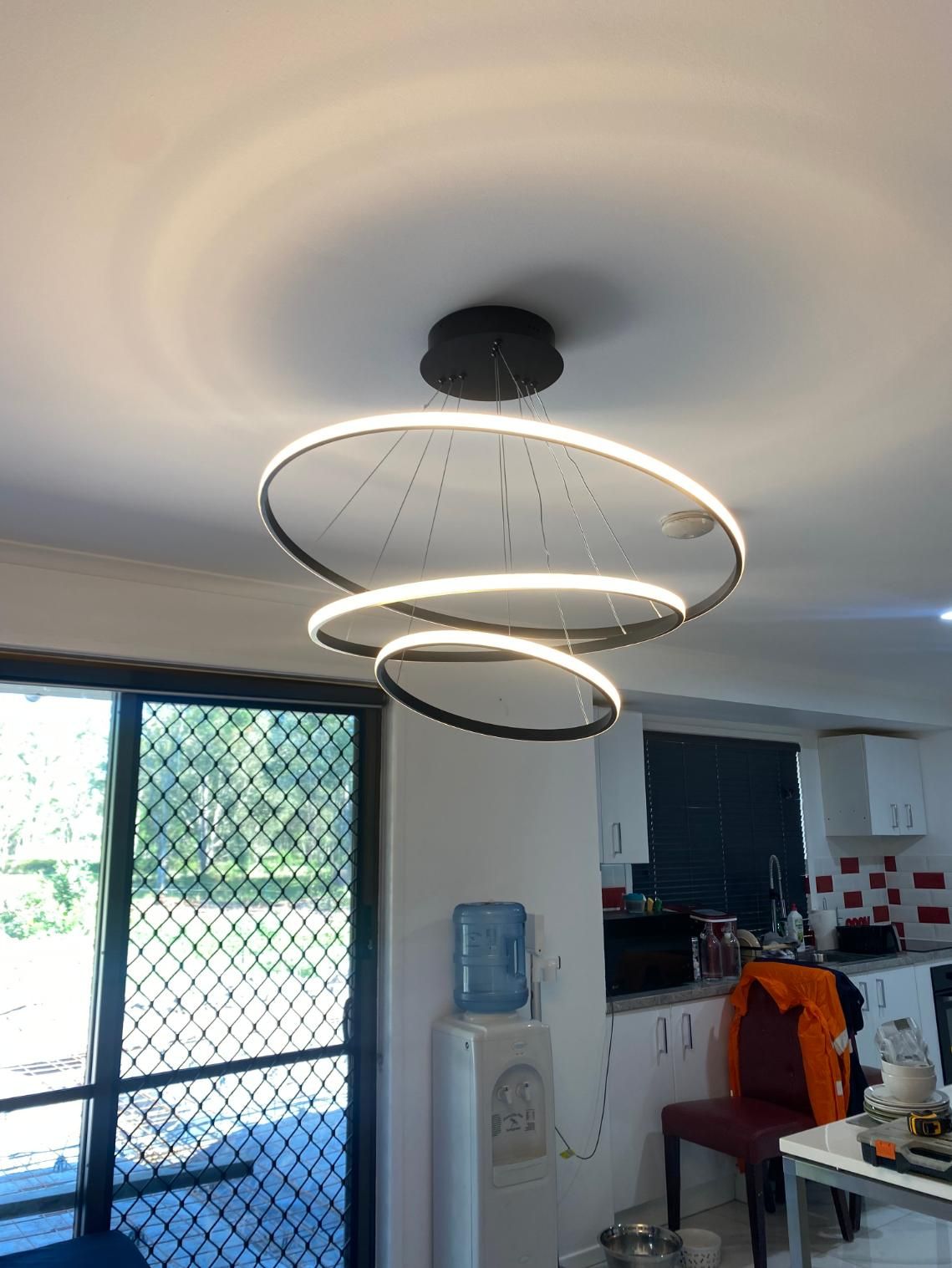 Ceiling Light is Hanging From the Ceiling in a Living Room — Brenden Wilson Electrical in Mooloolah, QLD