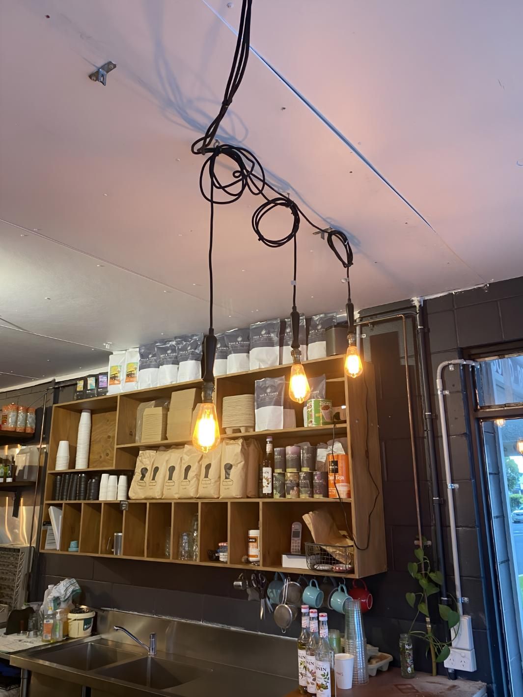 Kitchen With Lots of Shelves and Lights Hanging — Brenden Wilson Electrical in Caloundra, QLD