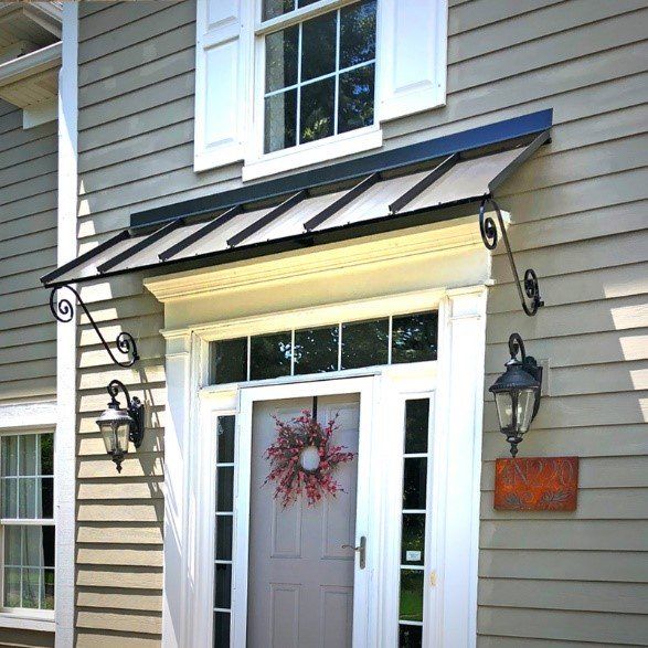 House with awning over door — Cheyenne, WY — Frontier Siding Supply