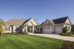 Shot of a nice and wide house with finely cut grass — Cheyenne, WY — Frontier Siding Supply