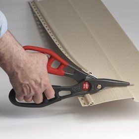 Person cutting a siding — Cheyenne, WY — Frontier Siding Supply