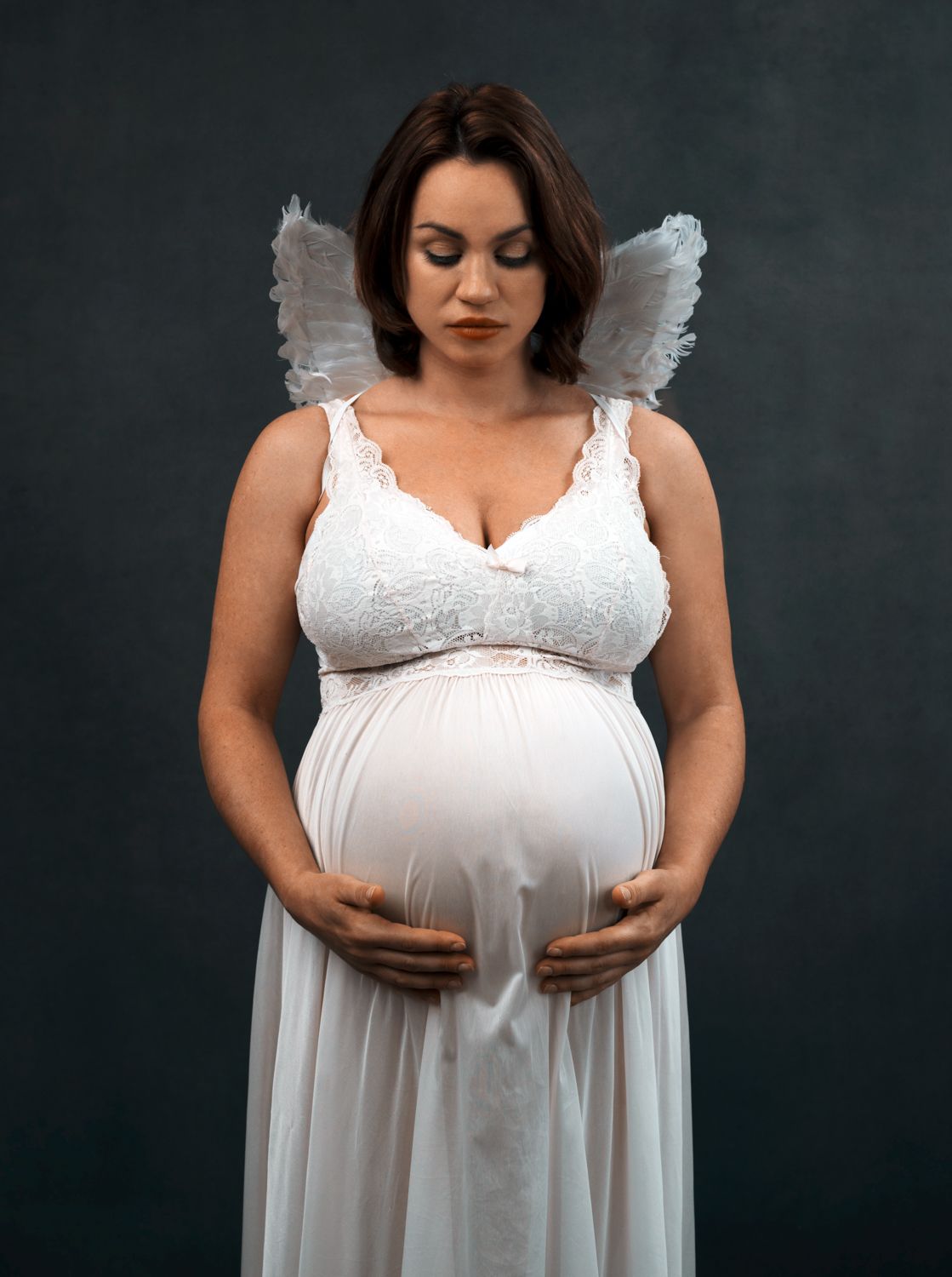 pregnant mother in maternity photography session in funky, trendy modern pose