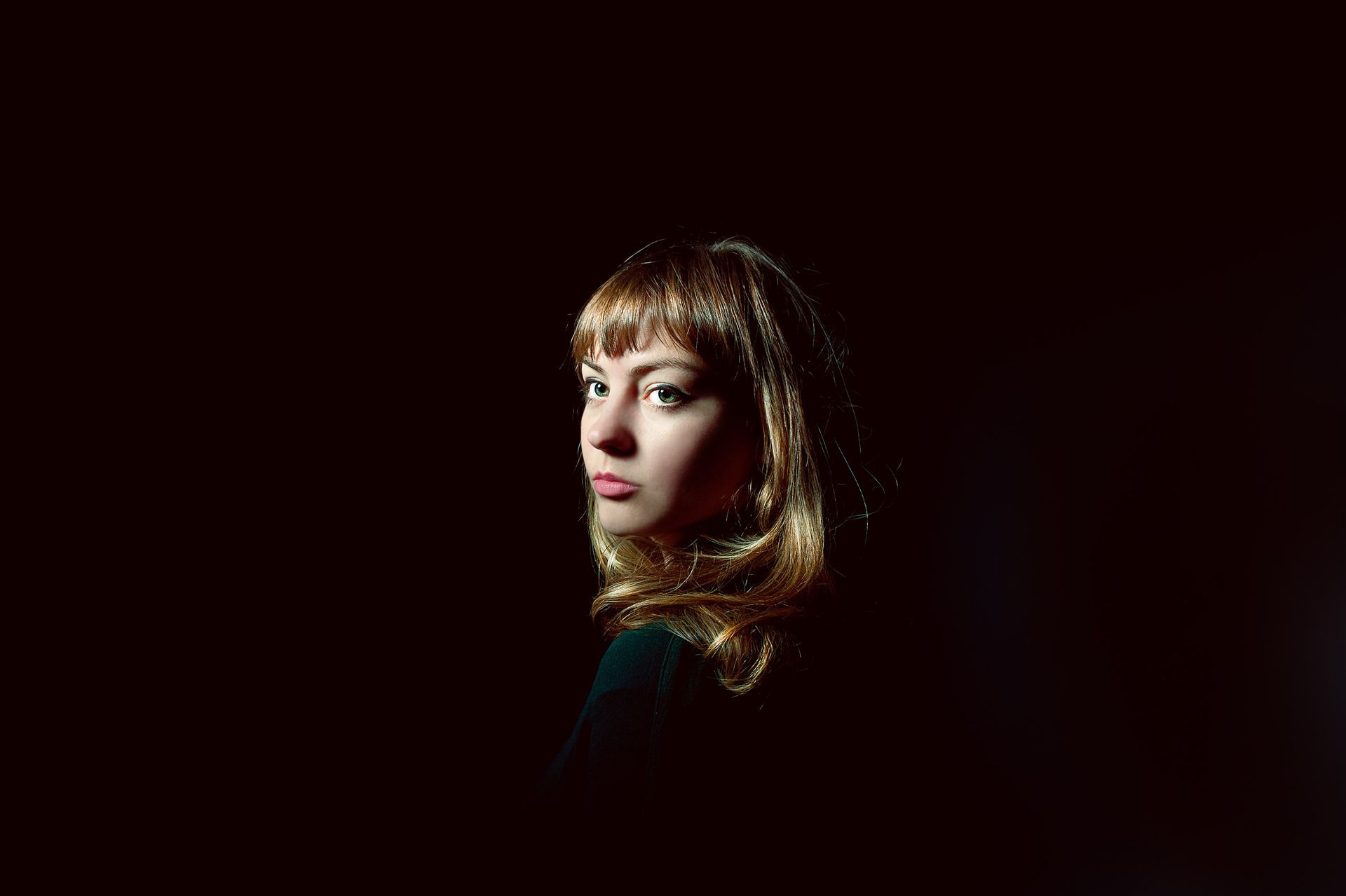 Angel Olsen and dramatic studio lighting