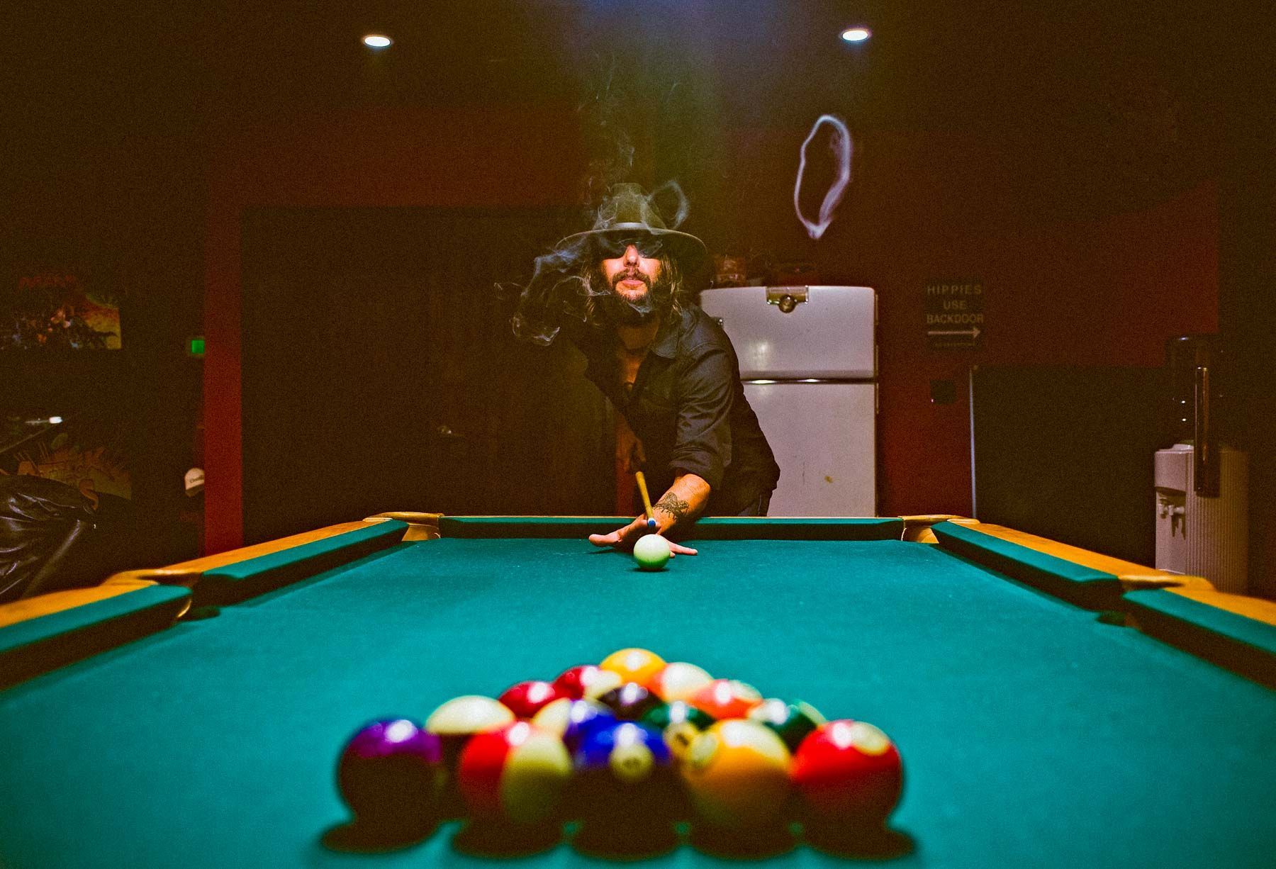 Ben Bridwell of Band of Horses shooting pool, Echo Mountain Recording Studio by Asheville North Carolina photographer Sandlin Gaither 