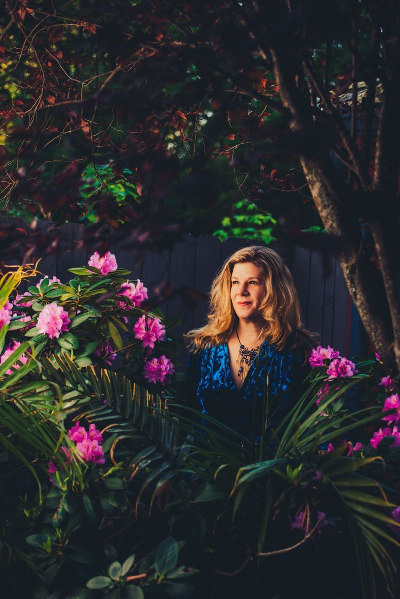 singer songwriter Dar Williams poses for promotional portrait on the patio of the Grey Eagle Music Hall, photographed by Asheville music photographer Sandlin Gaither 