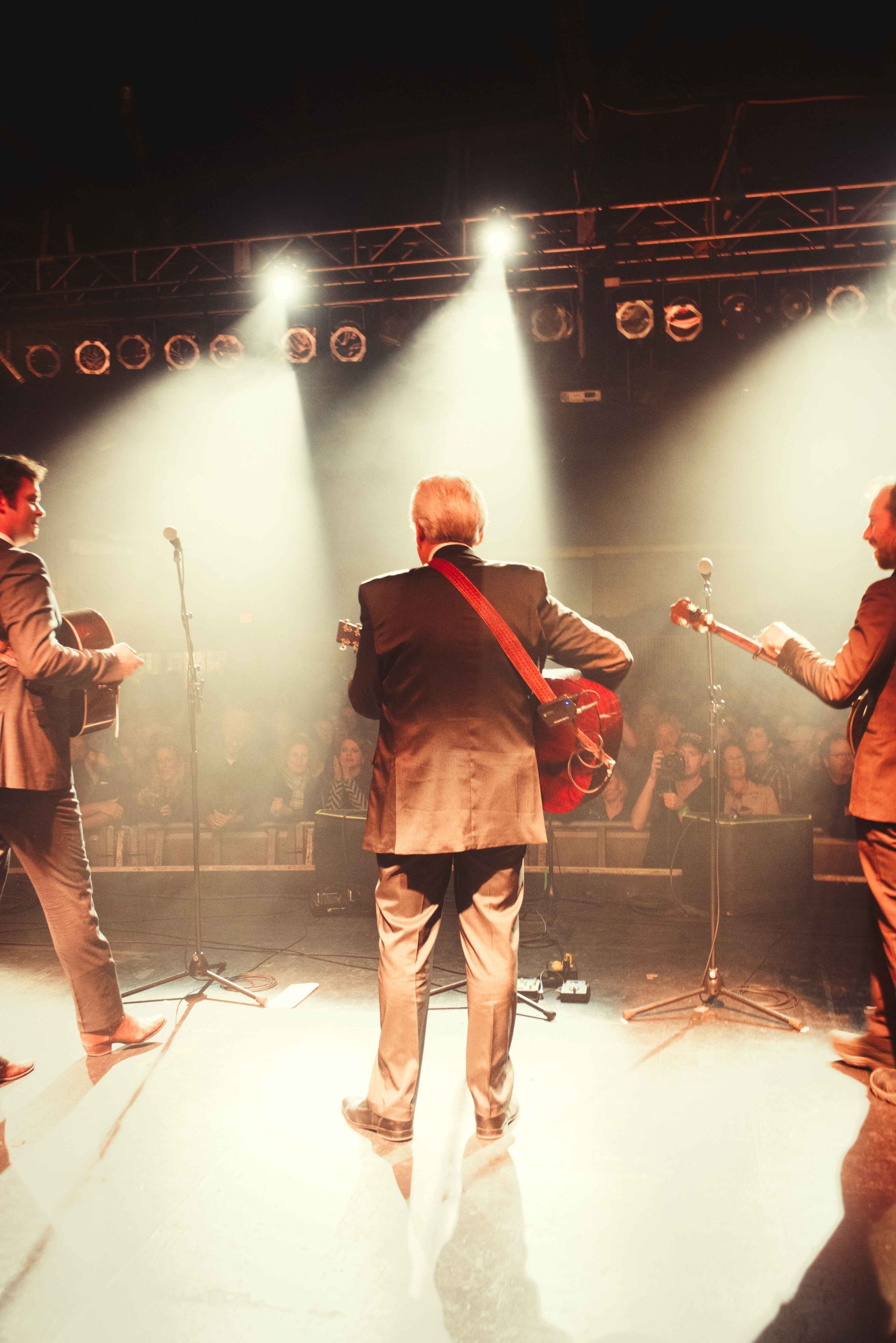 Bluegrass legend Del McCoury performs on stage at the Orange Peel in Asheville, North Carolina, with the Steep Canyon Rangers, photographed by music photographer Sandlin Gaither 