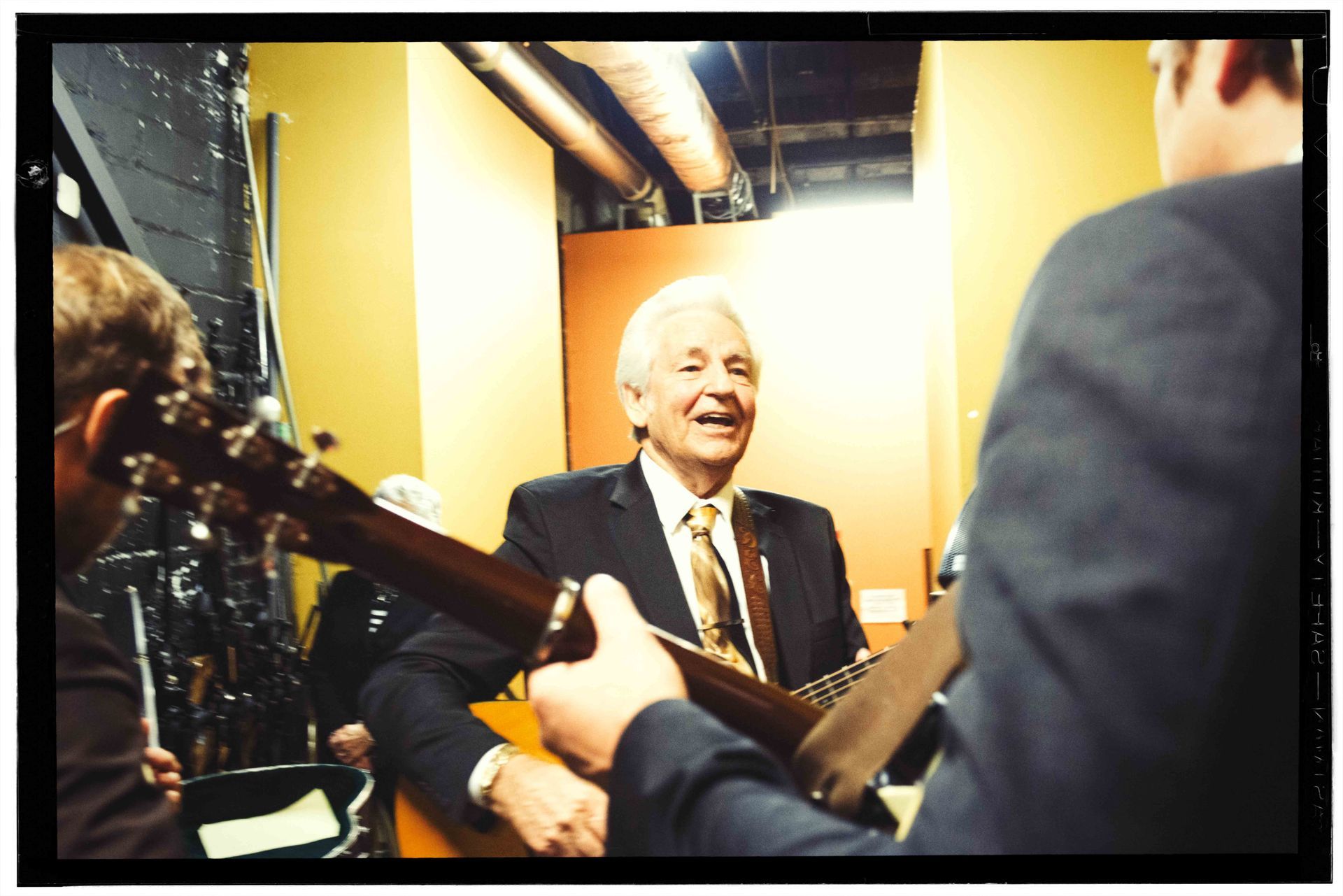 Bluegrass legend Del McCoury warm up backstage with Woody Platt of the Steep Canyon Rangers before taking the stage at the Orange Peel in Asheville, North Carolina, with the Steep Canyon Rangers, photographed by music photographer Sandlin Gaither 