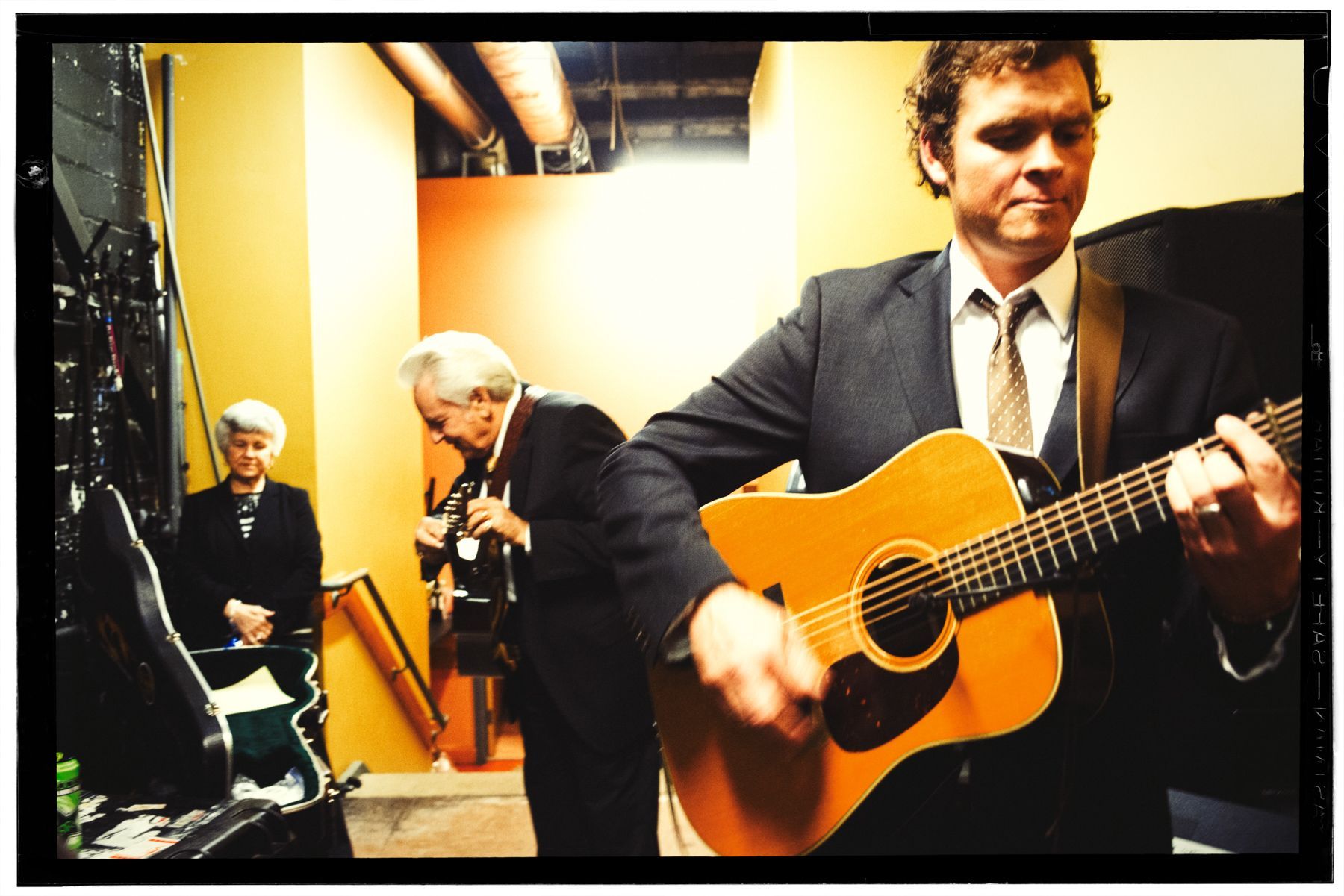 Bluegrass legend Del McCoury warm up backstage with Woody Platt of the Steep Canyon Rangers before taking the stage at the Orange Peel in Asheville, North Carolina, with the Steep Canyon Rangers, photographed by music photographer Sandlin Gaither 