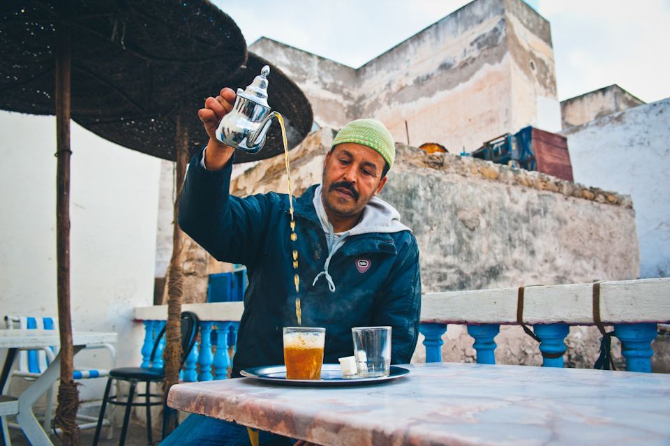 Moroccan man pouring mint tea, Essouraria, Morocco, small group travel tours Sandlin Gaither Explorer's Club