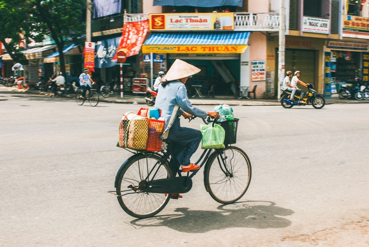 Bicycle scene in French colonial district — captured on Vietnam photo tour.
