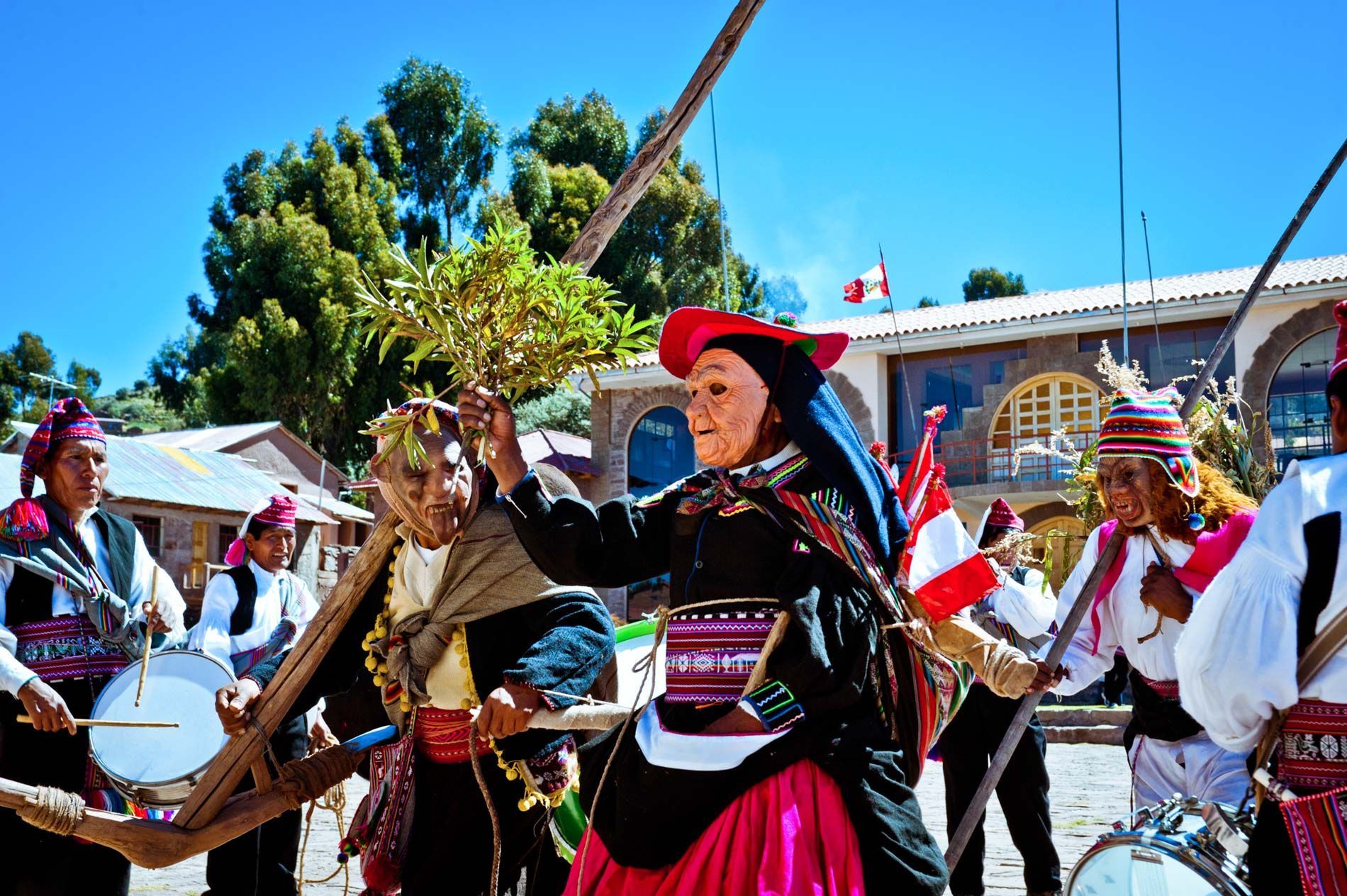 traditional celebration with masked performers, Isla Taquile, Lake Titicaca Peru, small group travel tours Sandlin Gaither Explorer's Club