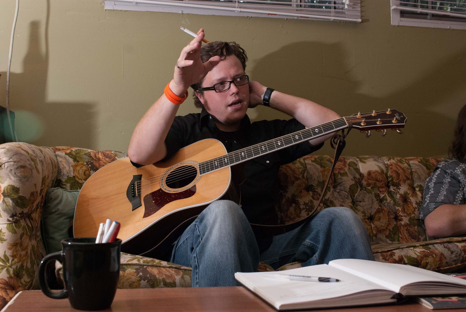 singer Jason Isbell rests backstage at Grey Eagle, photographed by music photographer Sandlin Gaither 