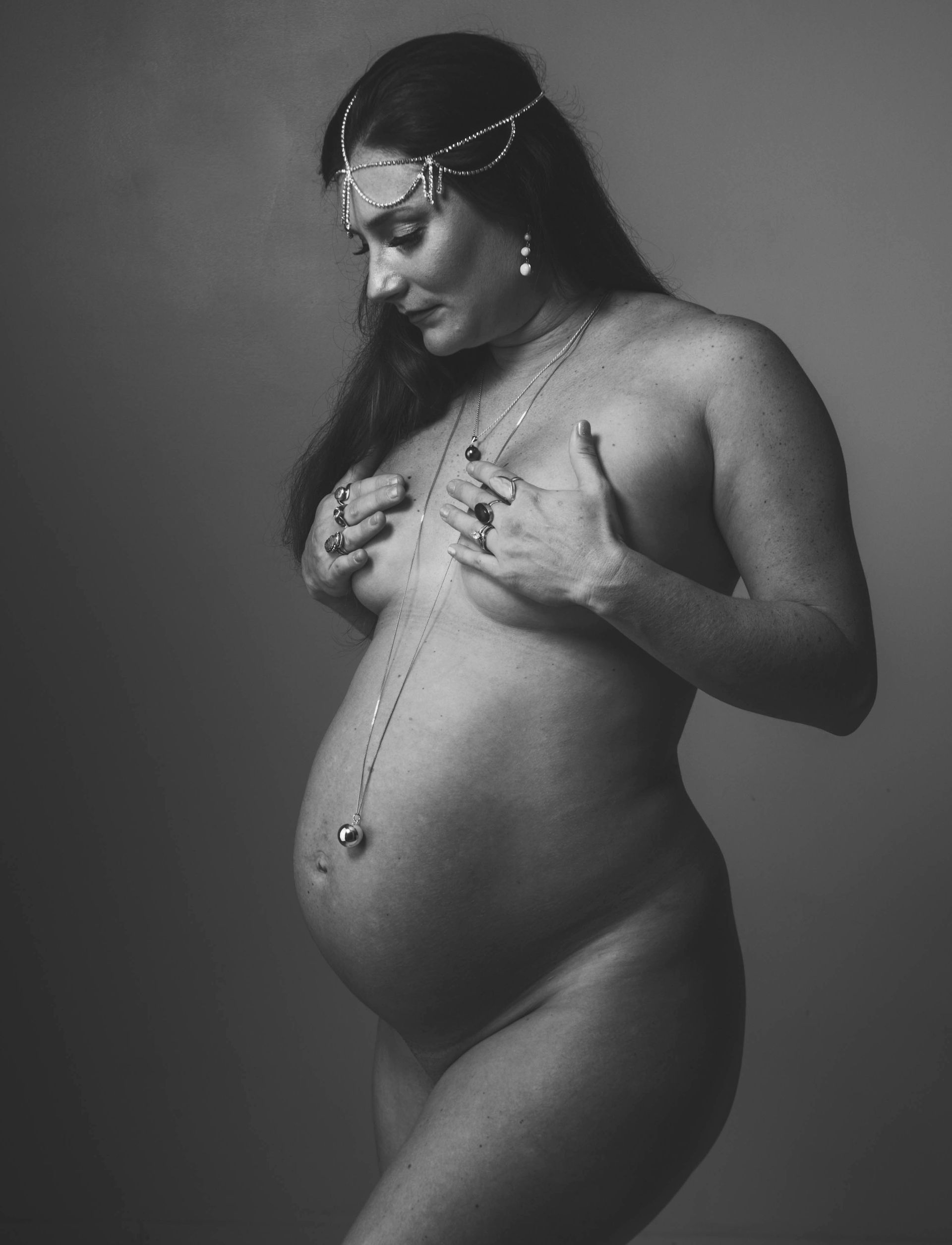 Beautiful mother in studio maternity portrait in Asheville NC.