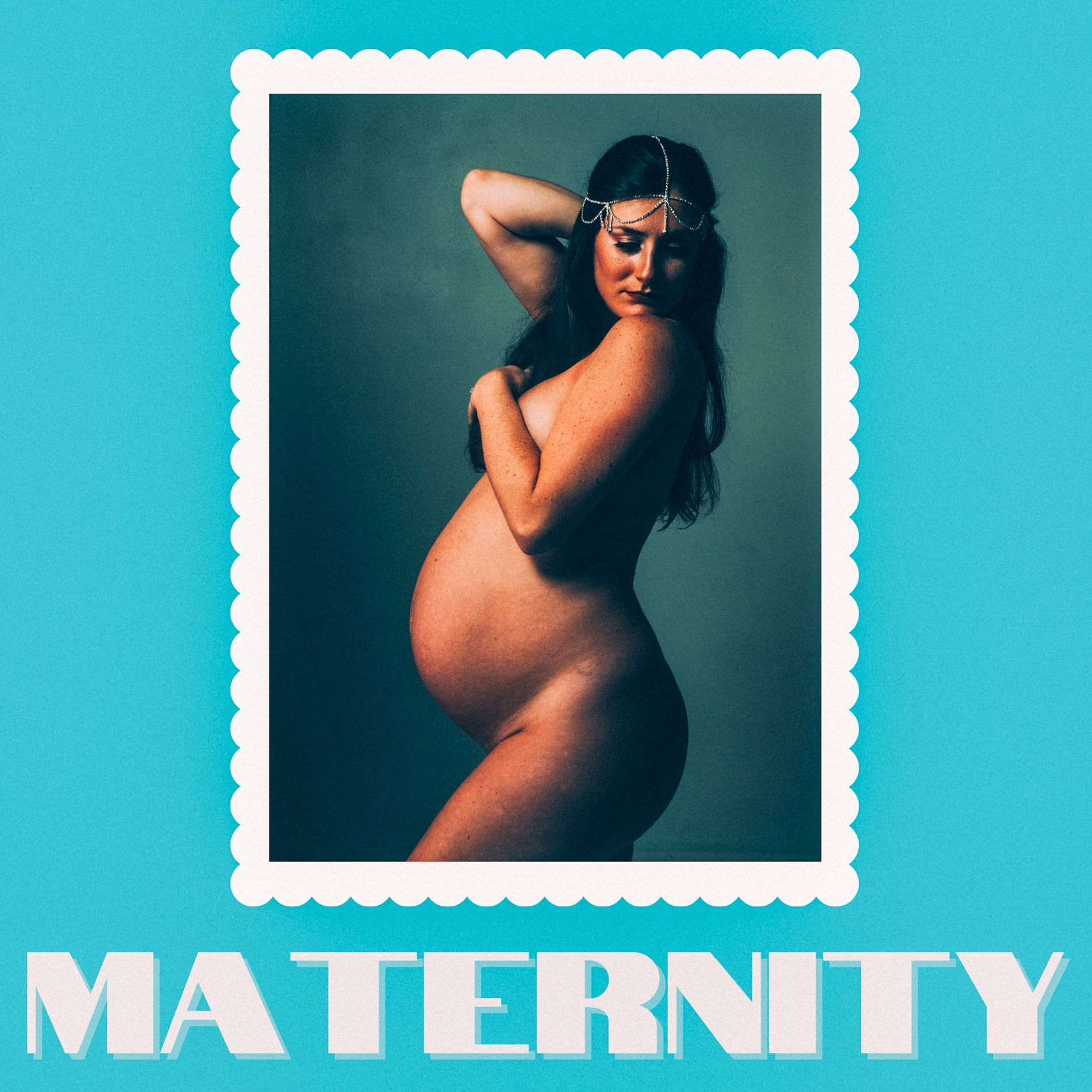 nude maternity model poses in Asheville photo studio