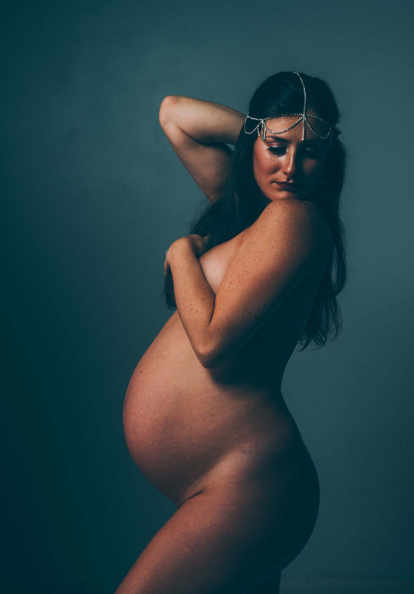 Beautiful mother in studio maternity portrait in Asheville NC.