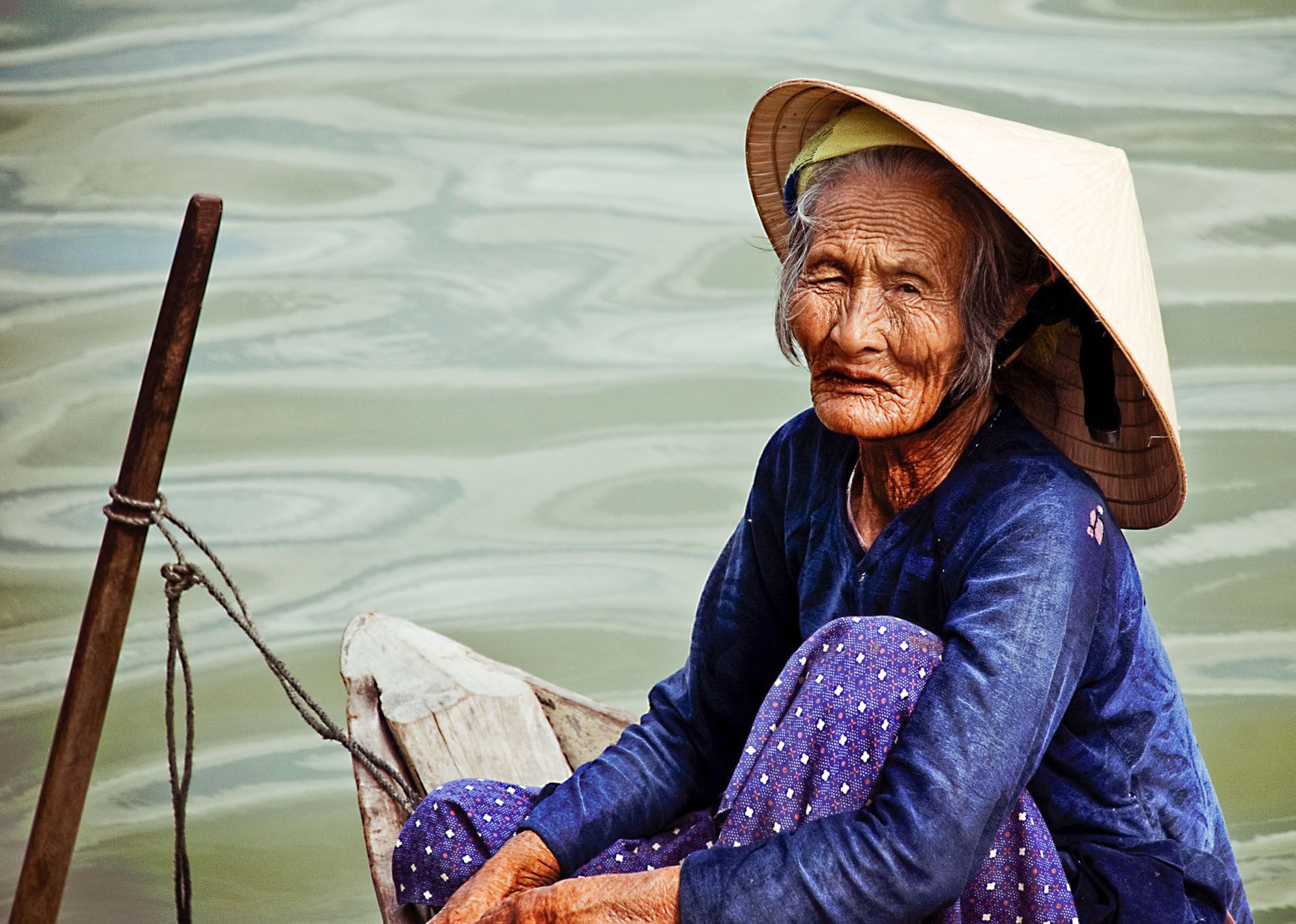 elderly woman on Hoi An River, Central Vietnam, small group travel tours Sandlin Gaither Explorer's Club