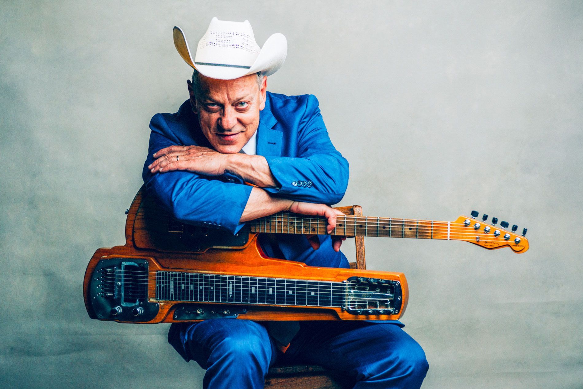 country lapsteel guitarist Junior Brown poses for promo portrait at the Grey Eagle Music Hall in Asheville, NC by music photographer Sandlin Gaither  
