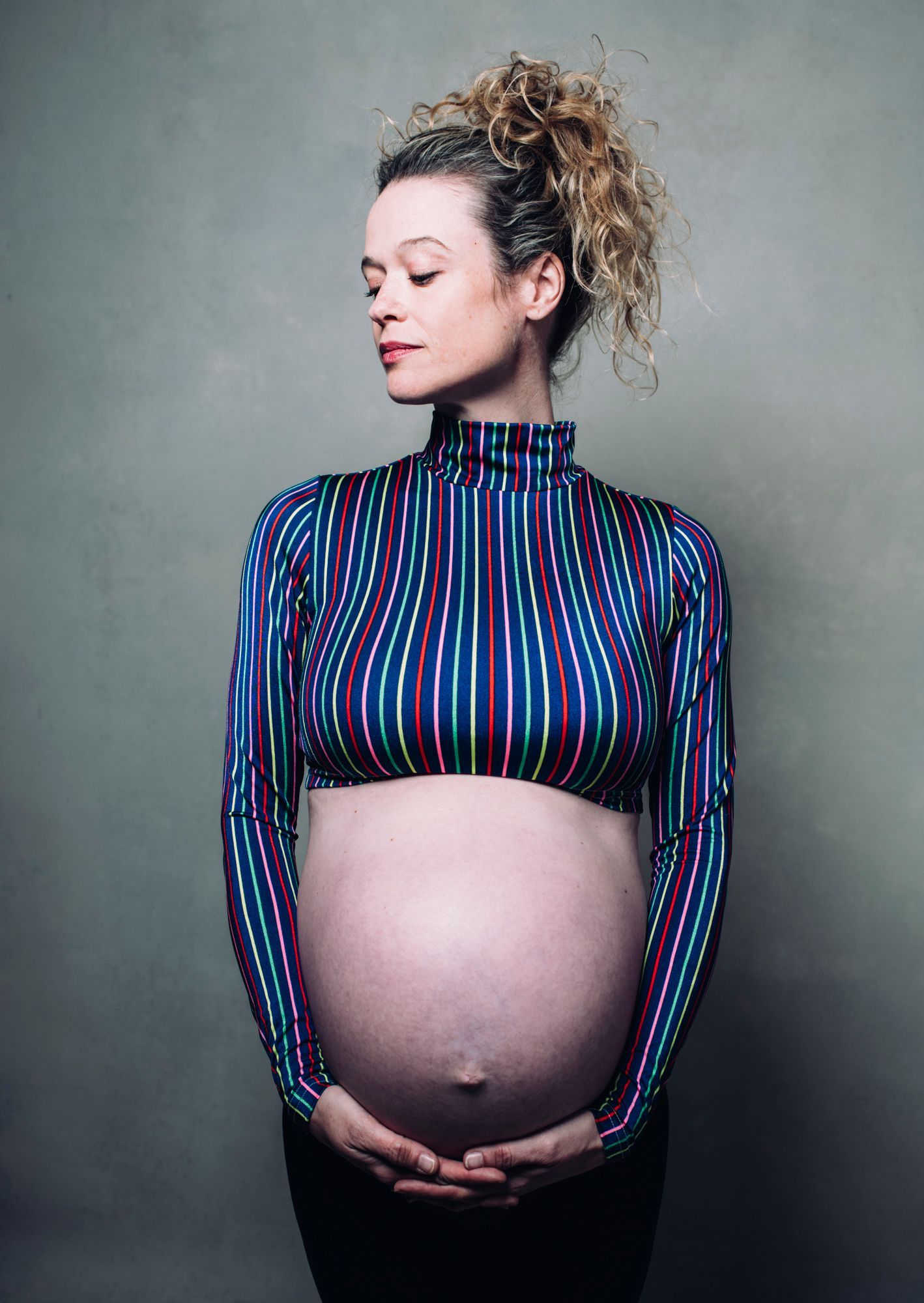 posed confident pregnant mother in asheville photo studio