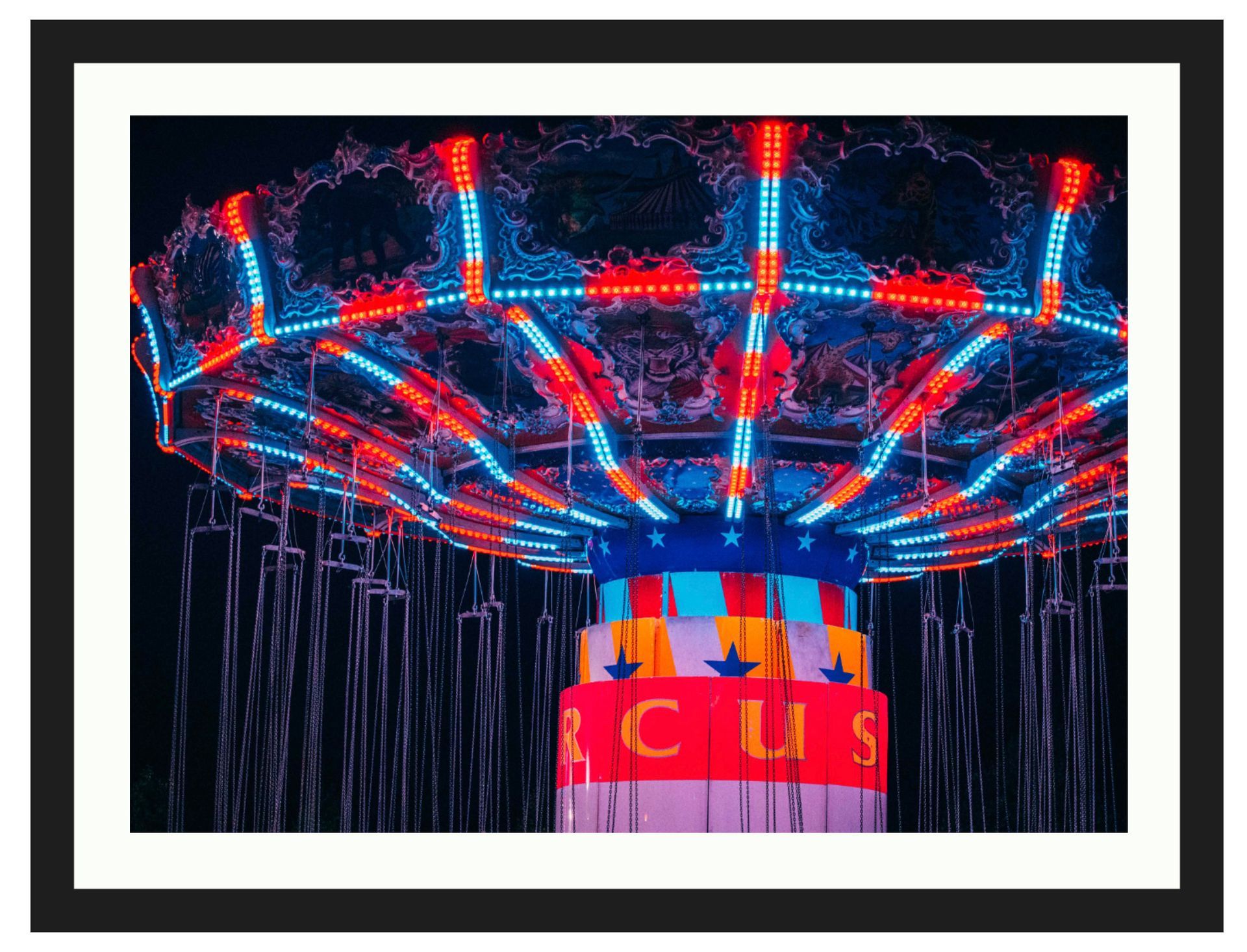 Neon-lit carousel canopy with red and blue lights and a yellow “CIRCUS” sign below