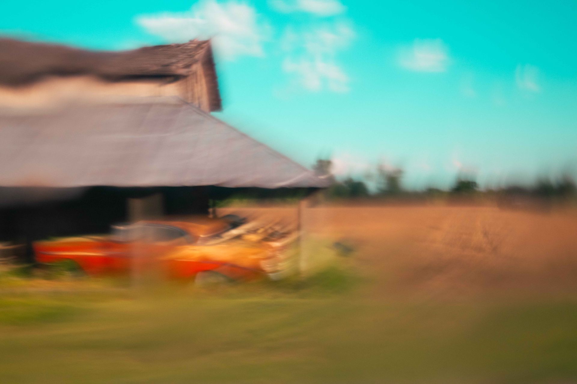 barn with car in motion, fine art print from asheville photographer Sandlin Gaither 