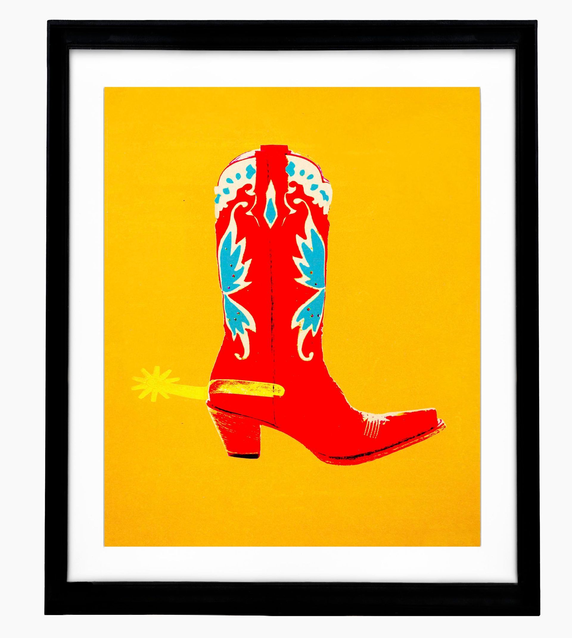Red cowboy boot with turquoise floral pattern on yellow background in black frame