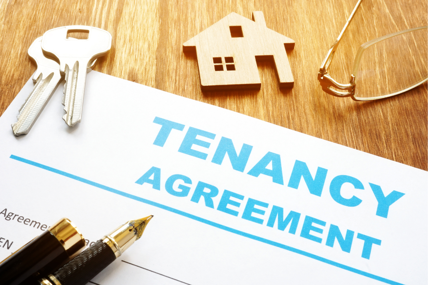 Close-up image of a tenancy agreement document, highlighting the detailed terms and conditions of a