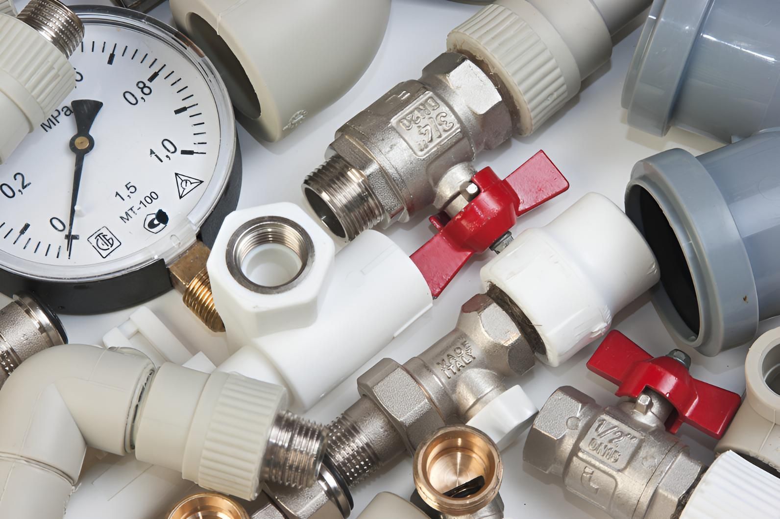 A Bunch of Plumbing Parts Including a Pressure Gauge — Vision Plumbing Queensland in Pimlico, QLD