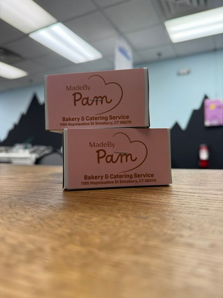 Two stacked pink business card boxes,