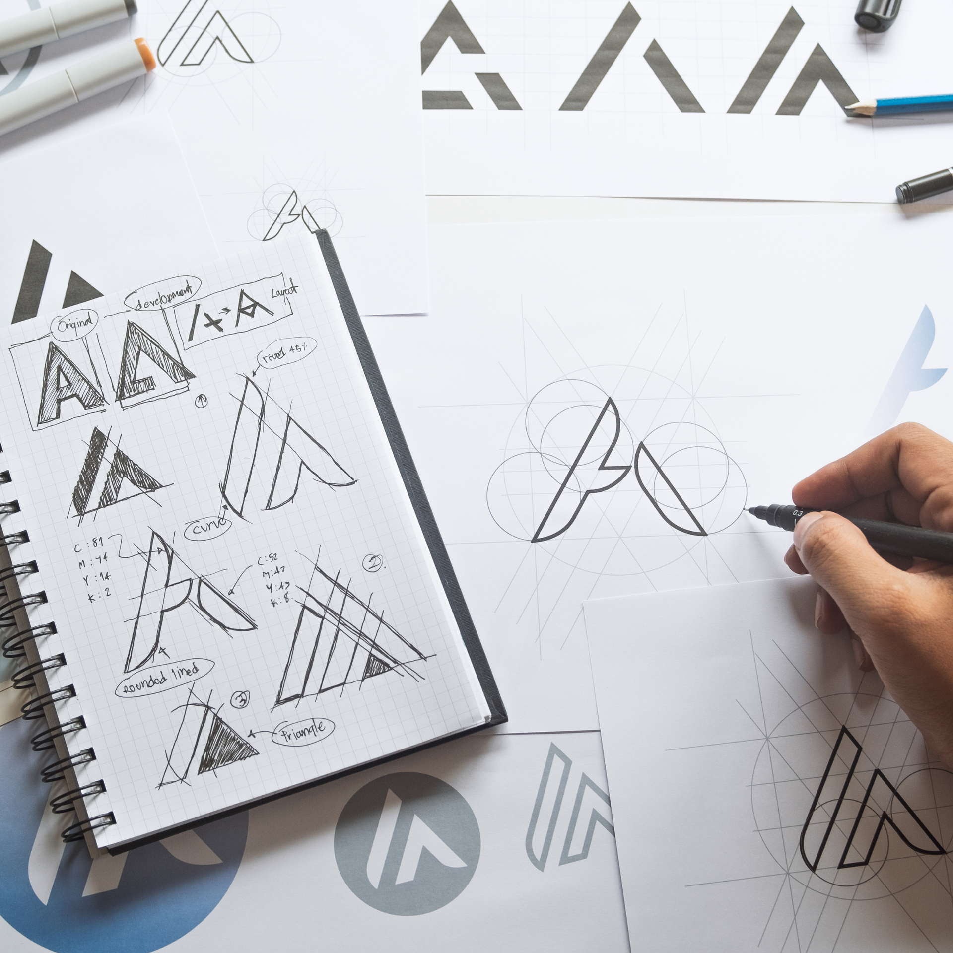 Hand sketching logo designs of the letter 