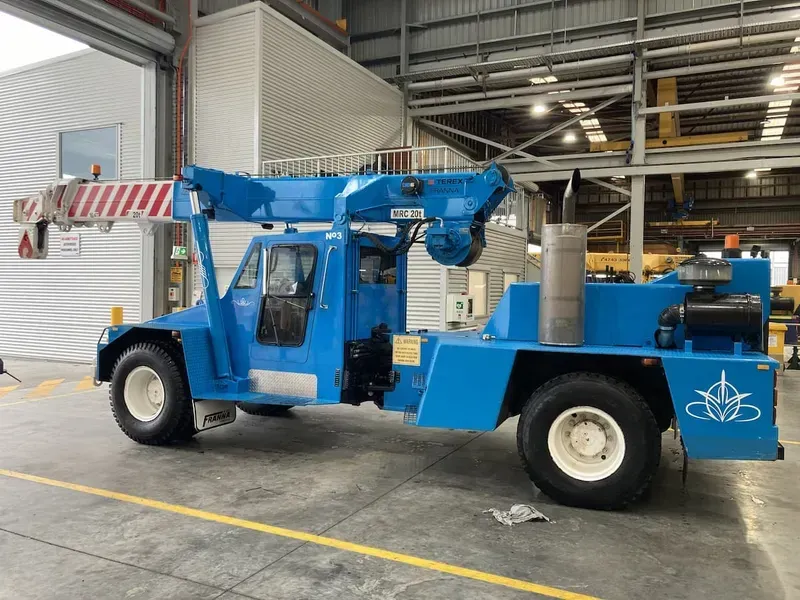 Blue Aerial Lift Truck Inside a Warehouse — Presto's Cranes & Rigging NQ in Garbutt, QLD
