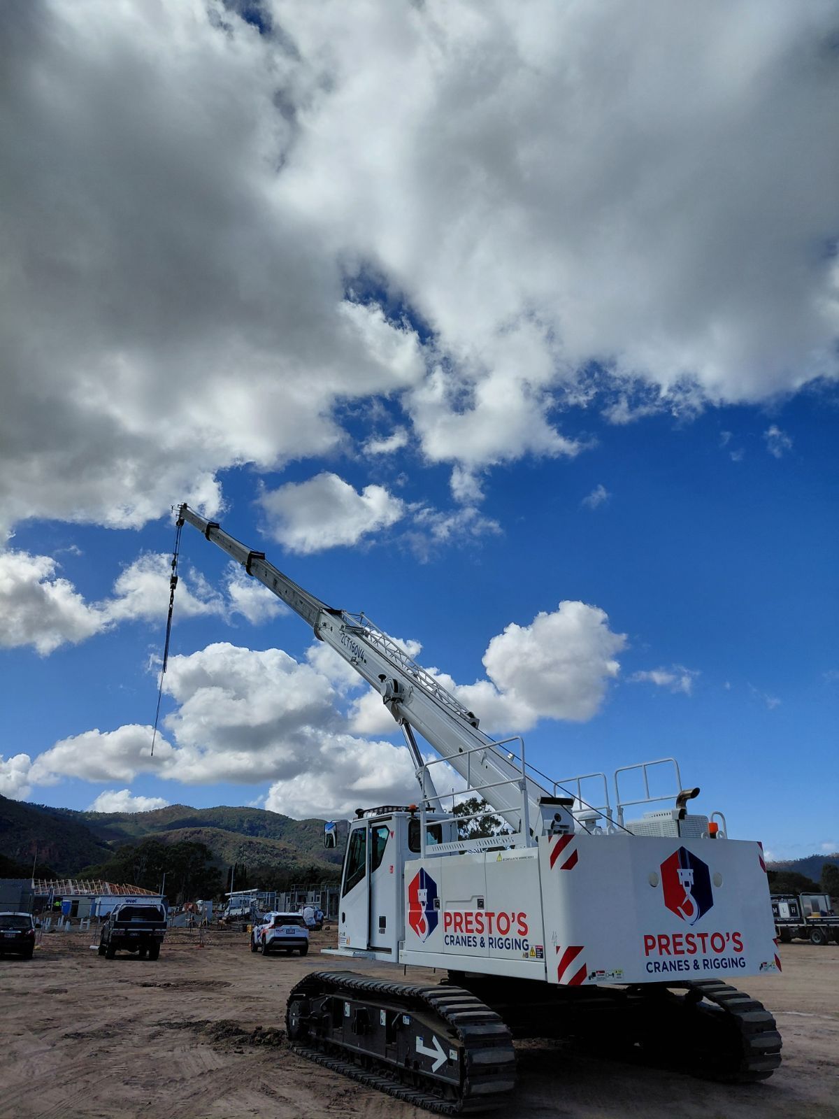 White Crawler Crane With Boom Extended — Presto's Cranes & Rigging NQ in Garbutt, QLD