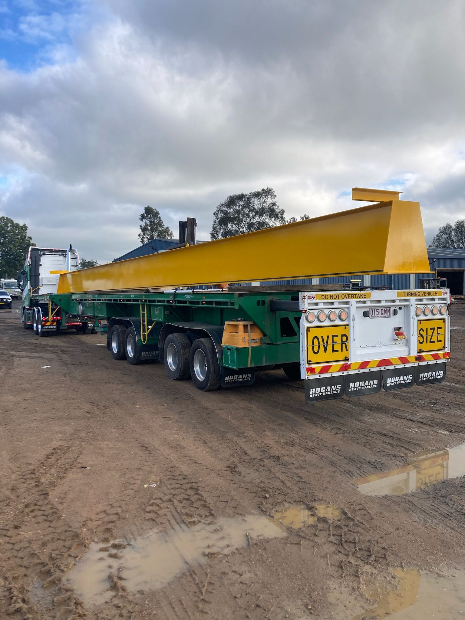 A Truck With A Yellow Crane On Top Of It Is Parked In A Dirt Lot — JMG Maintenance & Fabrication In Muswellbrook NSW