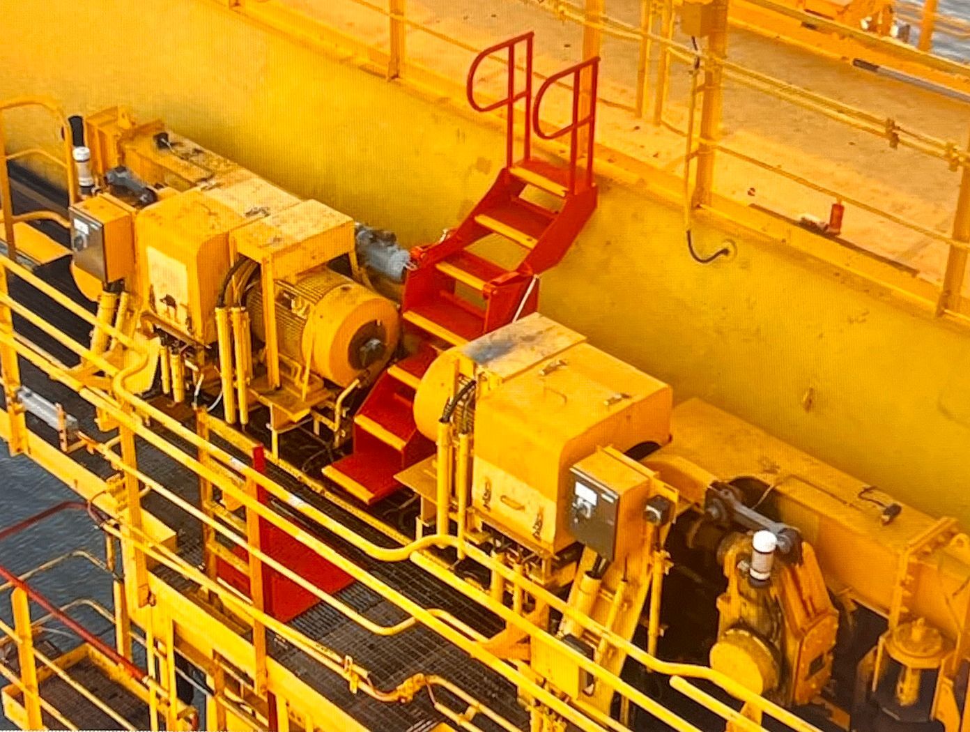 An Aerial View Of A Yellow And Red Machine With Stairs Leading Up To It — JMG Maintenance & Fabrication In Muswellbrook NSW