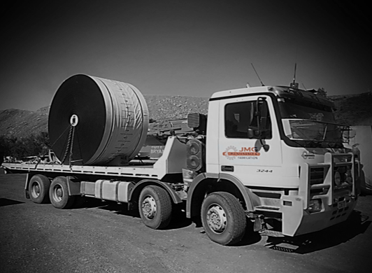 A Truck Is Carrying A Large Cylinder On The Back Of It — JMG Maintenance & Fabrication In Muswellbrook NSW