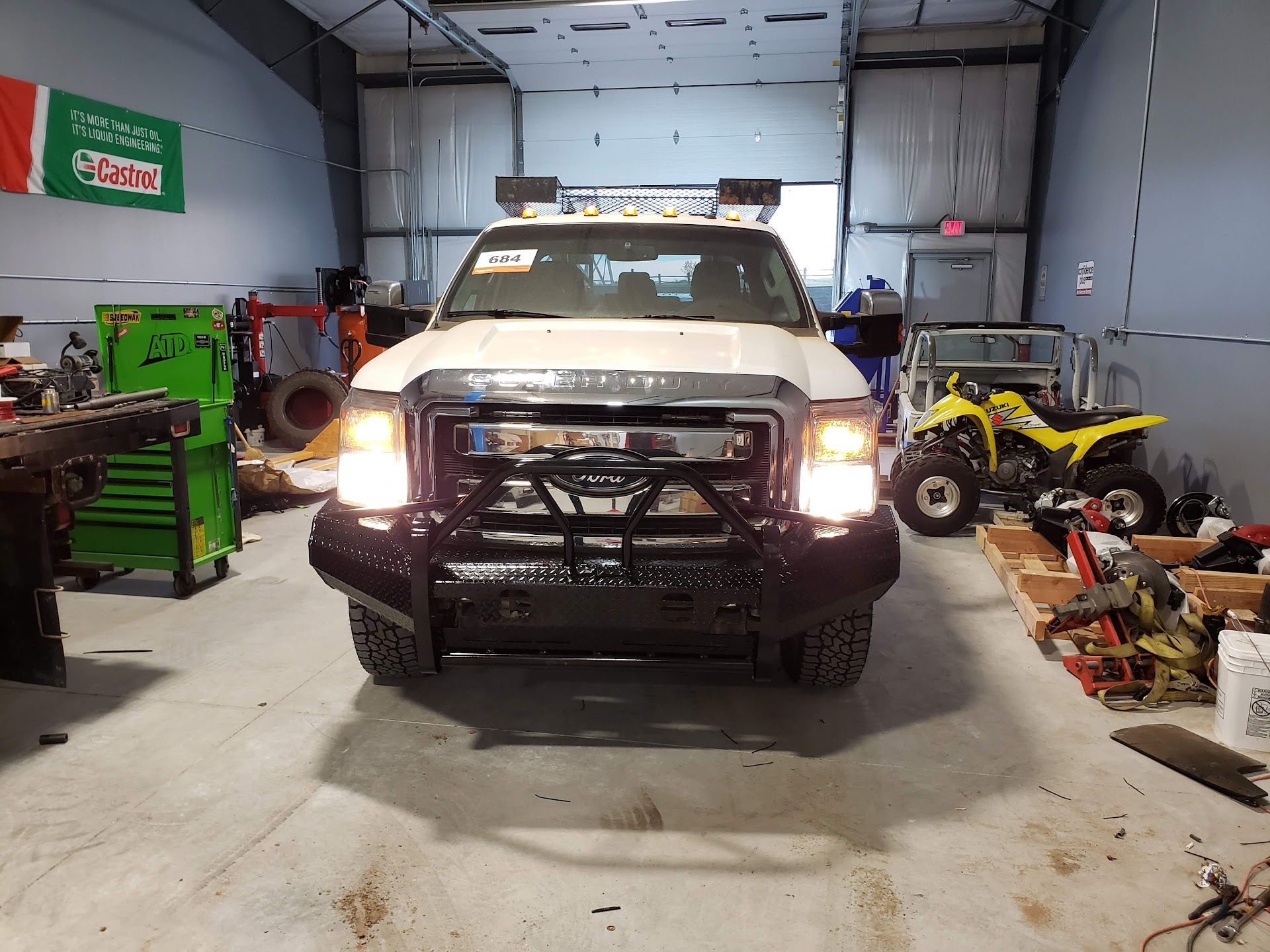 White Truck In Auto Repair Garage | Wolfies Tire & Auto