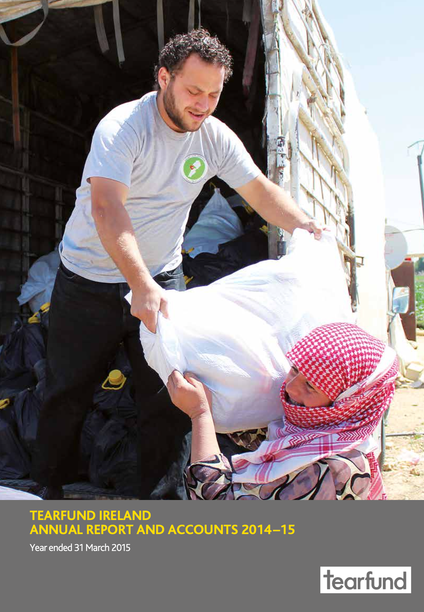 Man helps woman unload supplies from truck.