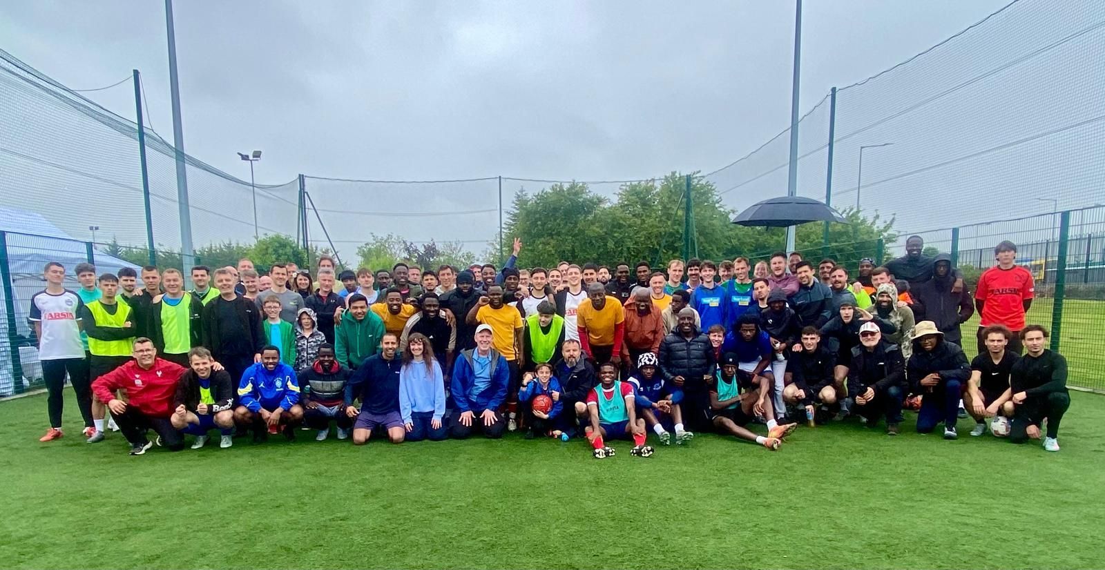group pic on the pitch of the 12 teams playing at the church blitz tourney