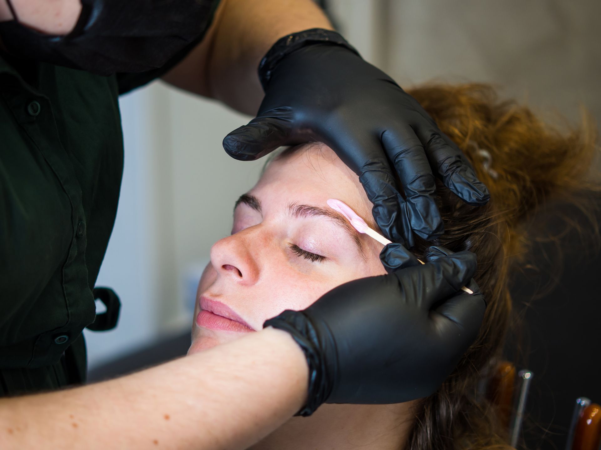 Image of a woman getting a brow wax