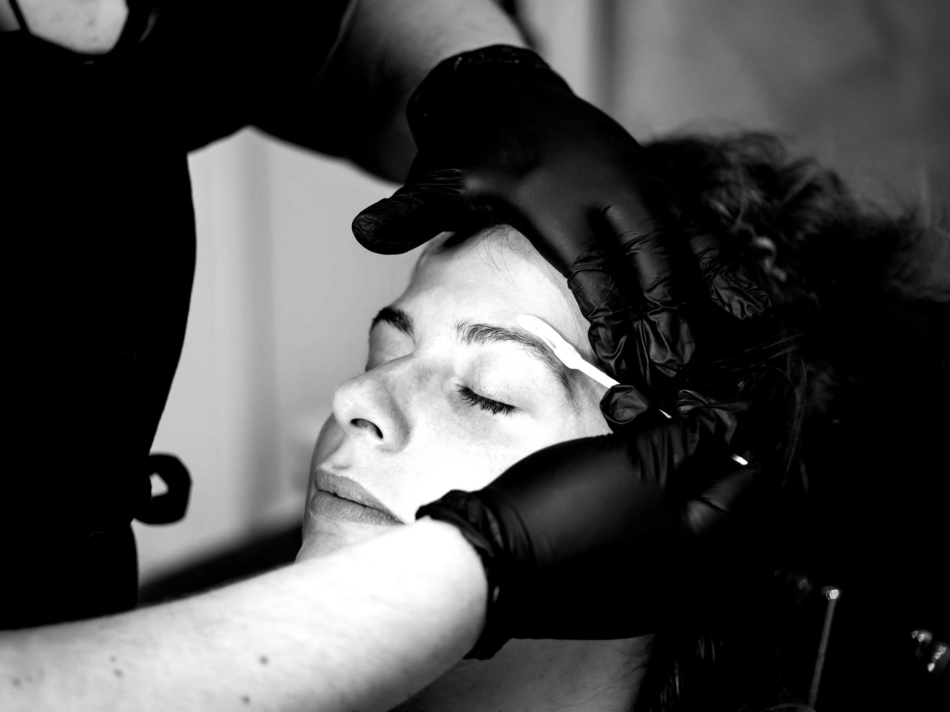 Image of a woman getting a brow wax